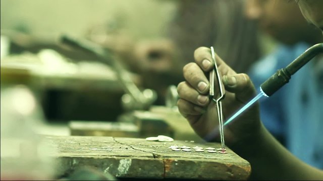 goldsmith welding silver pieces