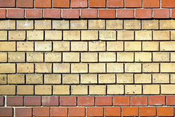 wall of bricks with mixed colors giving a harmonic pattern