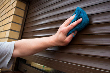 hand cleaning roller shutters