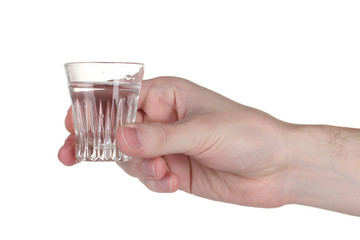 Man's hand holding a glass with vodka isolated on white