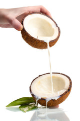 Coconut with coconut milk isolated on white
