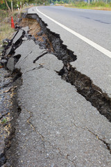 Side along the asphalt road collapsed because of erosion.