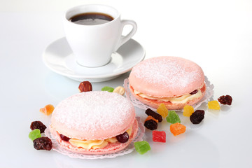Two cakes and white cup isolated on white