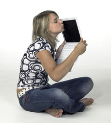 cute blonde girl kissing her laptop