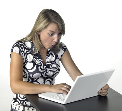 amazed blonde computing girl