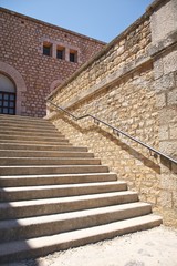 stone stairs with metal banister