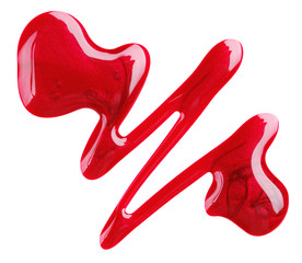 Red nail polish (enamel) drops sample, isolated on white