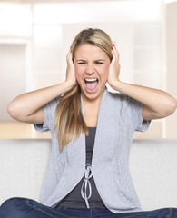 Young woman shutting her ears