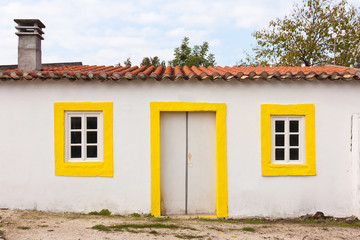 Fototapeta na wymiar White and Yellow House Facade