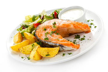 Grilled salmon, baked potatoes and vegetables