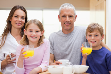 Happy family having breakfast