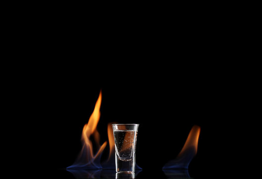 Flaming vodca on black background