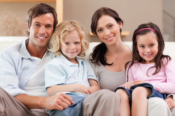 Happy family watching television together