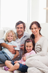 Portrait of a family relaxing on a sofa