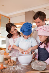 Portrait of a family baking