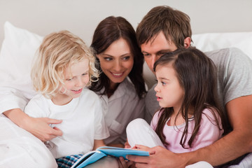 Family reading a book