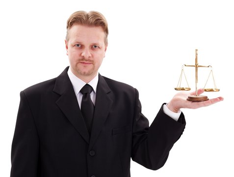 Serious lawyer holding justice scale