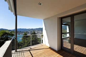Modern apartment, balcony overlooking the lake