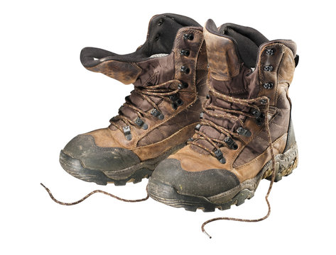 A pair of old hiking boots, isolated