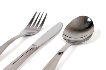 Fork, knife and spoon on white with soft shadow