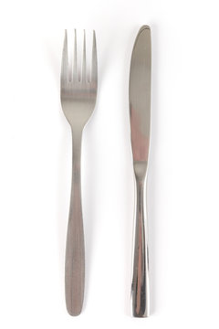 Fork and knife on white background with soft shadow