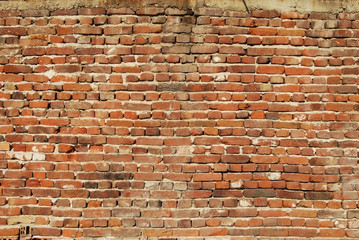 Non plastered old brick wall