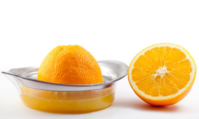 Orange with juicer on white background.
