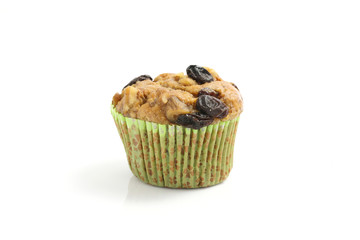 Muffin with raisins isolated on white