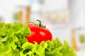 Tomato on salad leaf