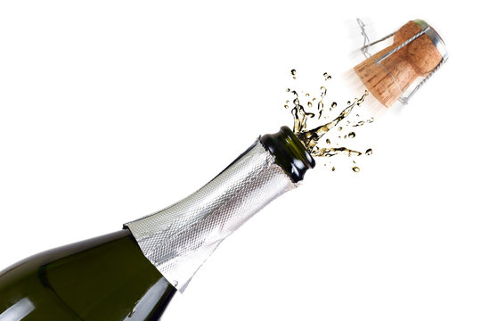 Bottle of champagne with splashes over white background