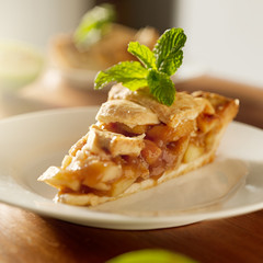 apple pie with mint garnish.