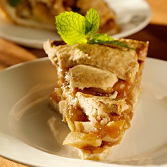 apple pie with mint garnish.