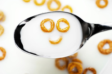 Smiling cereals in milk