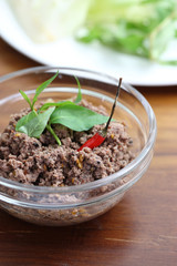 Thai food minced meat with vegetable and chilli on wood backgrou