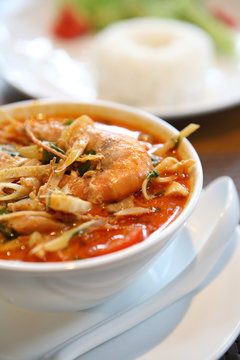 Tom Yum soup , a Thai traditional spicy prawn soup with rice