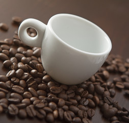 White cup with coffee beans