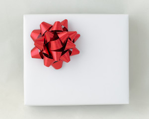 Top view of Red star ribbon on White paper box