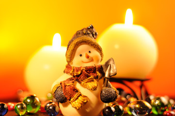 Christmas Evening – Snowman Figurine and Burning Candles