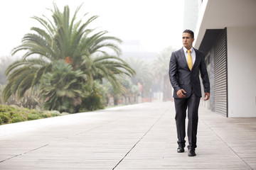 Confident businessman walking