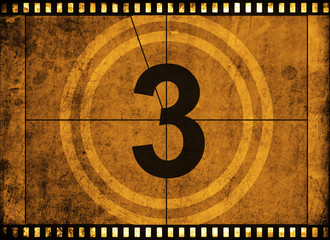 movie film strip with countdown number on grunge background