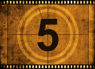 movie film strip with countdown number on grunge background