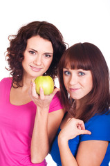 Fototapeta na wymiar Beautiful smiling girls with apple