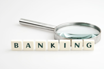 Banking word and magnifying glass