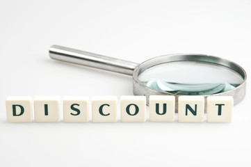 Discount word and magnifying glass
