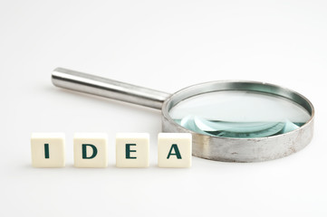 Idea word and magnifying glass