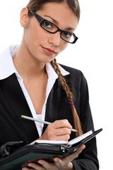 businesswoman taking notes
