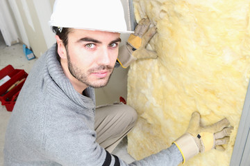 Man making sure house is well insulated