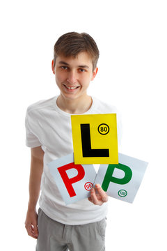 Teen holding magnetic driving licence plates for car