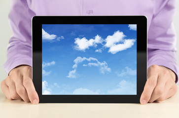 Businessman Showing Tablet PC With Cloudy Sky