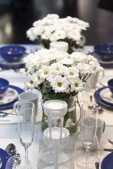 Flowers on blue and white dining table